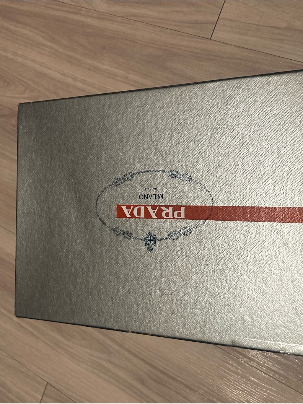 Prada Silver Box With Red Stripe Logo